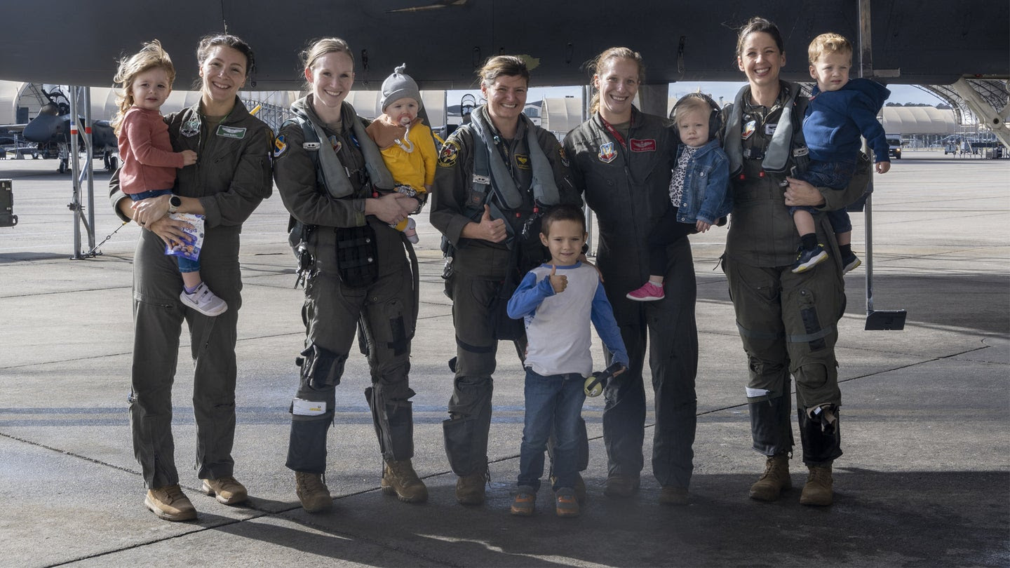 F-15E Strike Eagle fighter pilots with their children